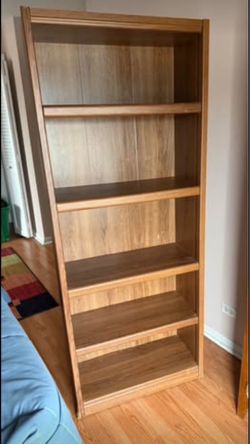 Tall light finished wood bookshelf