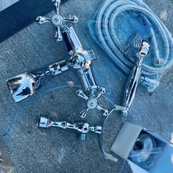 Kingston Brass Aqua Vintage Polished Chrome 3-handle wall-mount bathtub faucet set with a hand shower