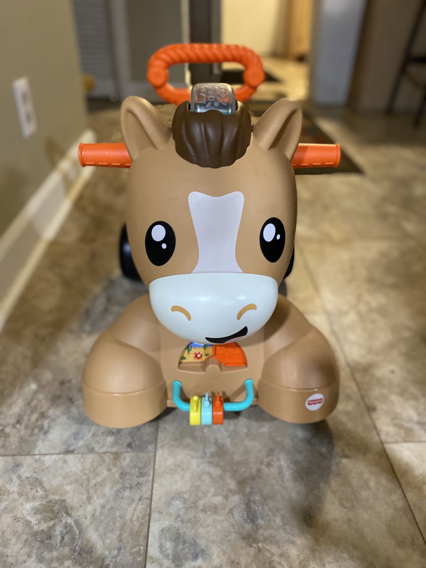 Fisher-Price Walk Bounce & Ride Pony Baby Walker and Ride-on Learning Toy with Music and Lights.