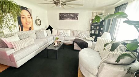 Light grayish white sectional with round chair