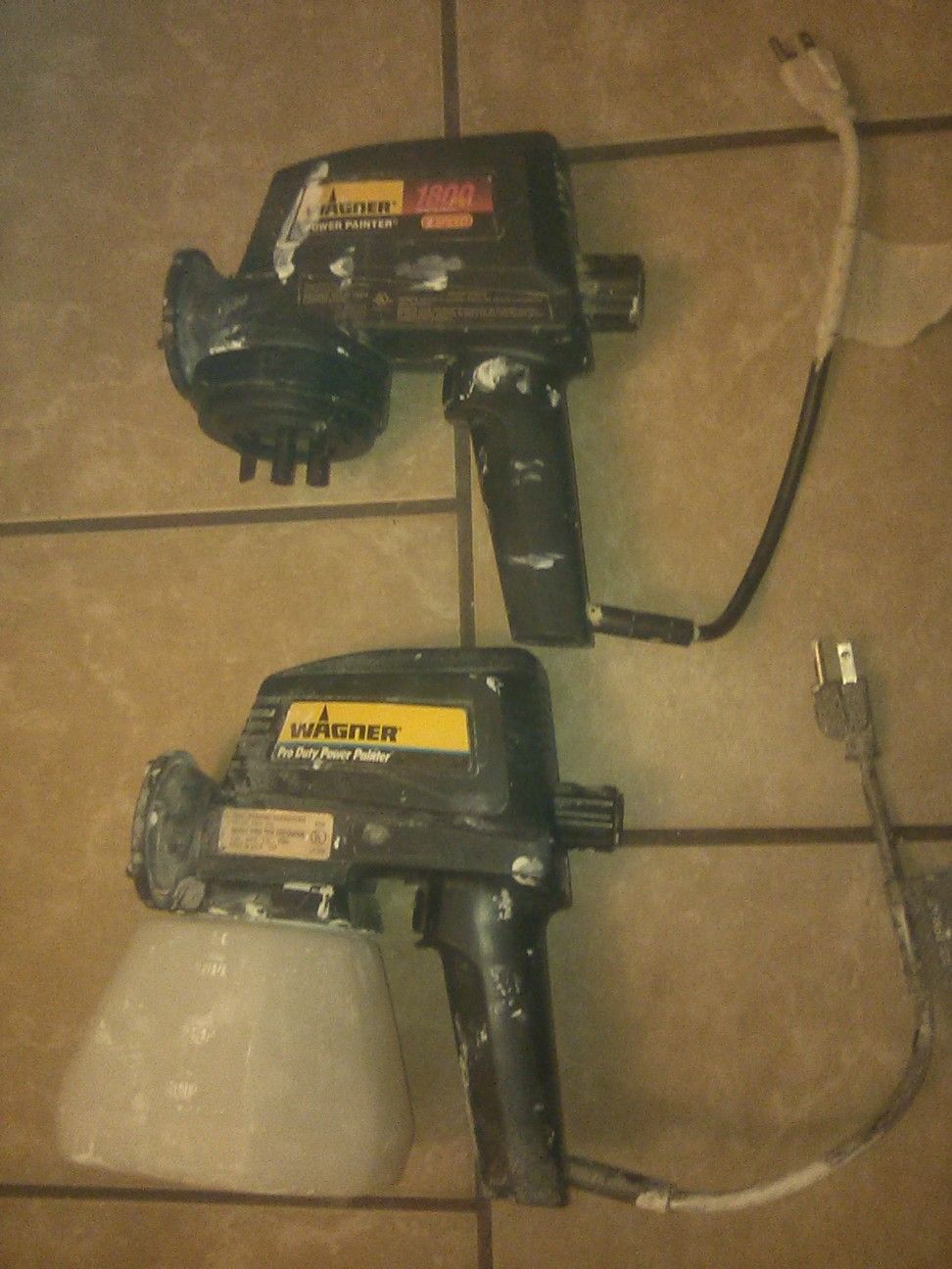 Two Wagner power paint sprayers