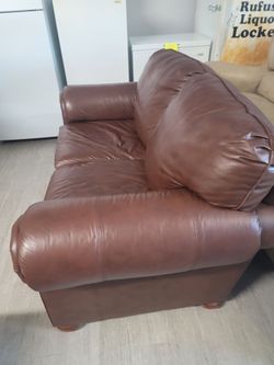 Brown leather loveseat