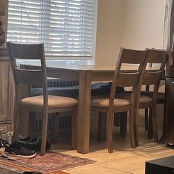 Table with four chairs   6 feet long by 3 feet wide