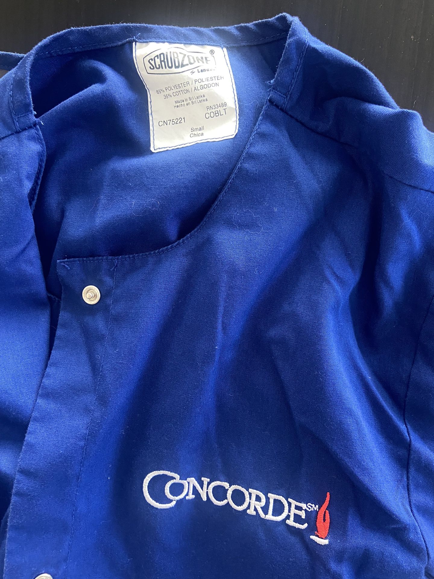 Two Concorde career college blue nursing uniform scrub