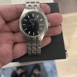 The Bulova Classic Men's Watch, model 96B265, stainless steel with a black dial.