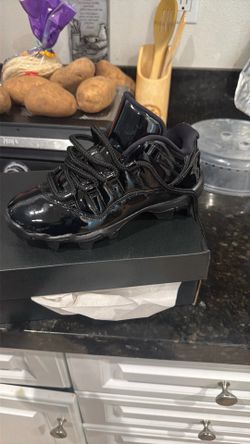 Jordan 11 low black youth cleats