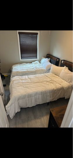Twin beds with pillow and comforter sets