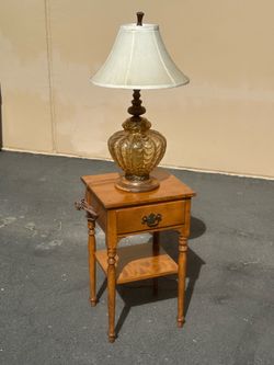 Antique end table with antique lamp