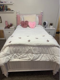 Two white twin pottery barn bed frames