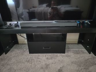 Tv stand with shelves and a drawer