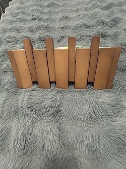 Piano style rack for keys an coats