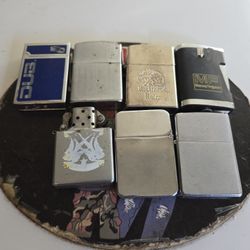 Seven vintage zippo lighters