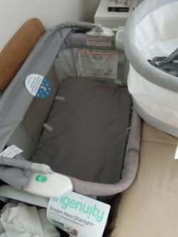Graco bassinet and crib  combo with music, bassinet NWT