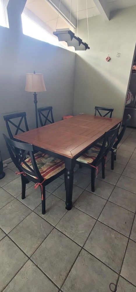 wooden table with six chairs
