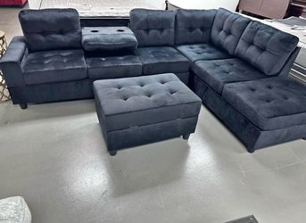 Black Water Resistant Fabric Reversible Sectional with Cup Holder and Storage Ottoman. Brand New.