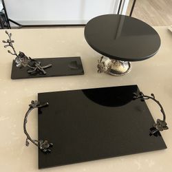 Michael Aram used Lot White & Black Orchid Collection   Marble cheeseboard $140  (Black orchid) Wine holder $75 (black orchid)  Cake stand $150 (white