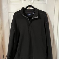 Men’s Black Size Large long sleeve pull over shirt.  Made of 100% Polyester.  Brand The Gap.  Preowned very good condition.  Smoke free home 