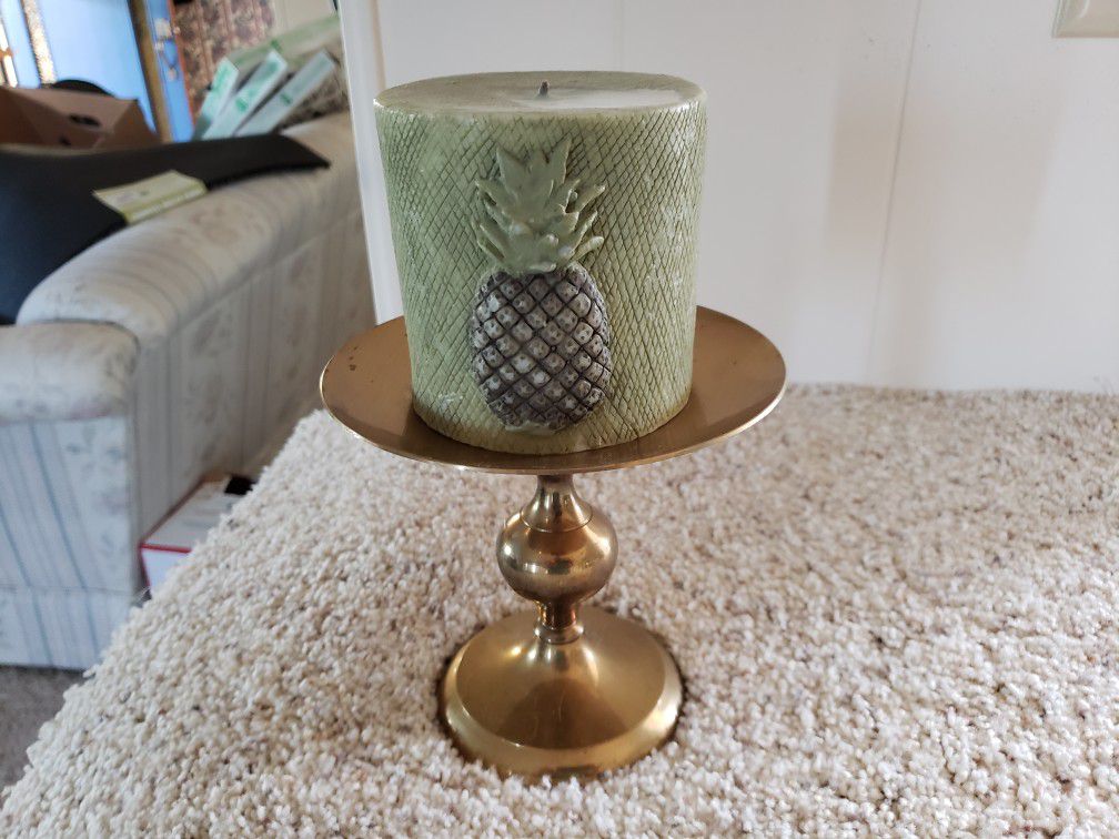 Brass candle holder with candle