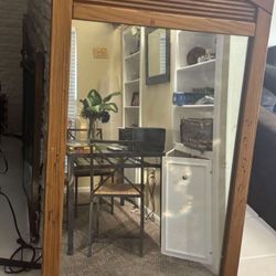 solid wood frame wall mirror Dimensions are 48 inches high and 28.5 inches wide. new in condition