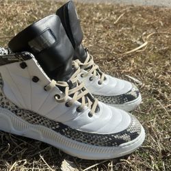 Javon Russell distinct snakeskin pattern along the midsole and heel, similar in style to custom designs Shoes 