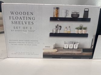 Black wooden floating shelves