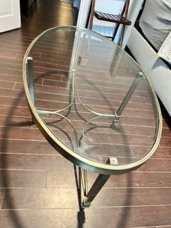 Glass coffee table with gold accents