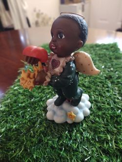 Boy Angel Holding A Heart Filled With Stars 