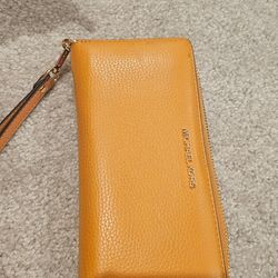 Tangerine Jet Set Travel Large Pebbled Leather Wristlet