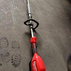 Milwaukee M18 FUEL QUIK-LOK pole saw with power head.