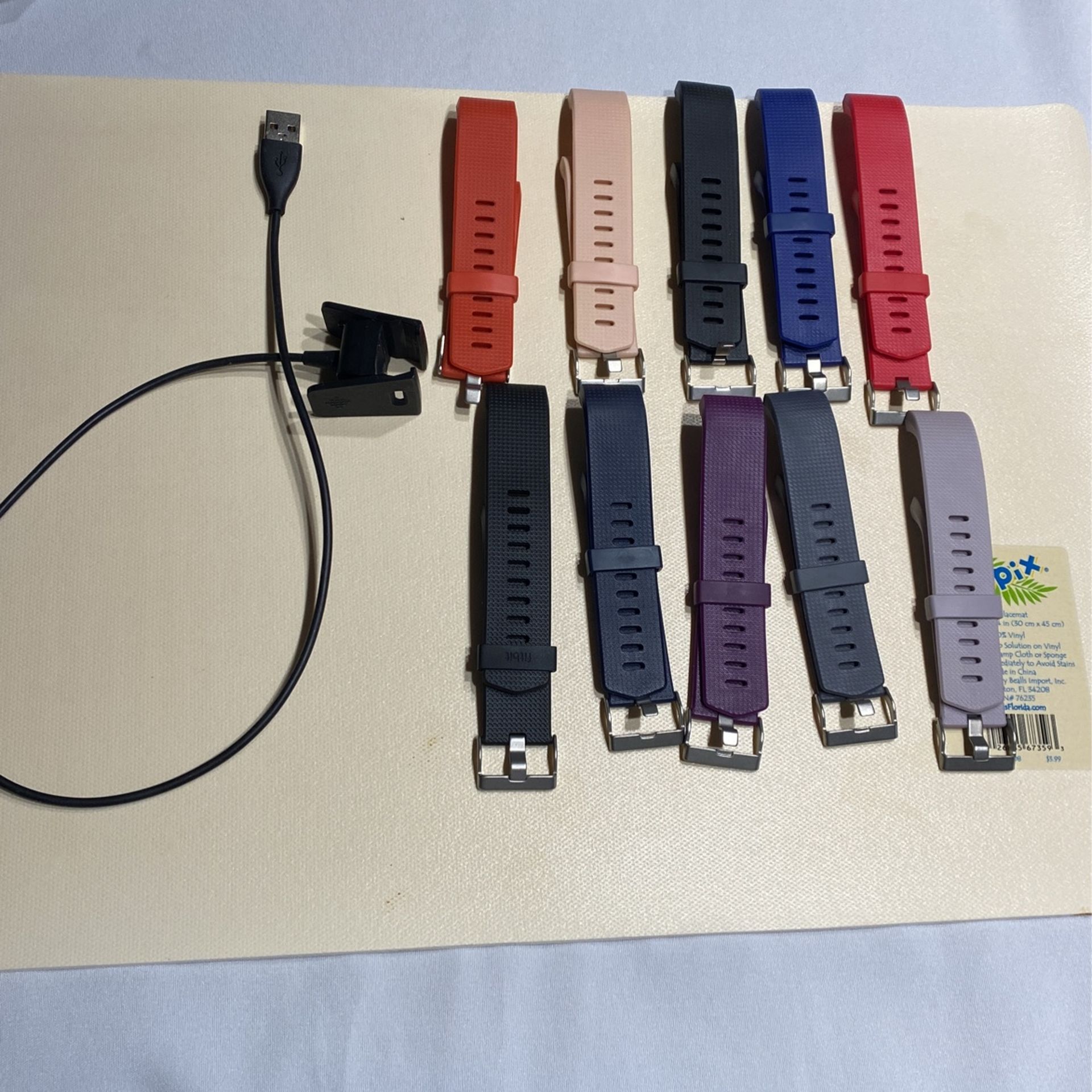 Fitbit charge two plug and 10 bands $20