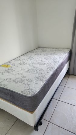 New twin mattress and box spring 2 pc bed frame is not included