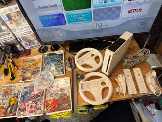 Nintendo Wii Video Game System RVL-001 Console W/6 Games Mario Kart 2 Wheels Lot  The Nintendo Wii Video Game System RVL-001 Console Bundle is a class