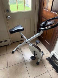 Fitness Indoor Cycling Bike, a silver, foldable stationary exercise bike