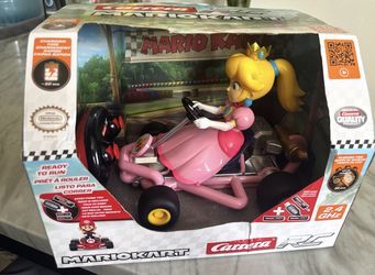 Brand new, never opened Carrera RC Mario Kart Pipe Kart – Peach edition.