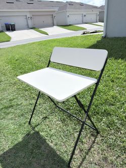 Selling a foldable work desk with a shelf.