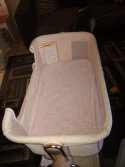 Pink baby bassinet