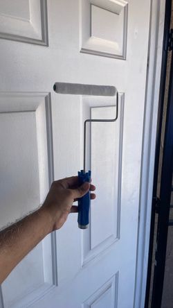 Paint Roller with Blue Handle both new ready to paint