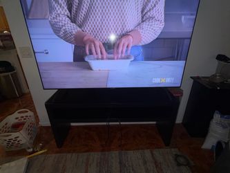 70 in Samsung Smart TV and Black Wood TV Stand