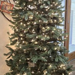 9 Ft Pre Lit (a Few Light Are Out But Can Be Fixed) $150 And Red Sled $75