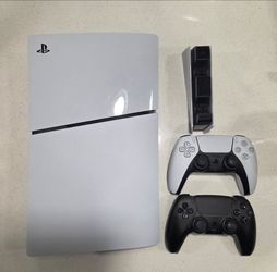 PlayStation 5 (PS5) with 2 controllers and charging dock