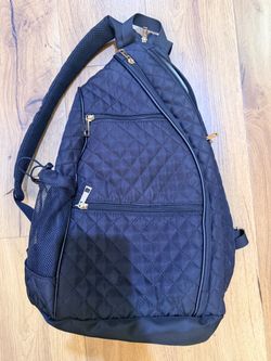Black backpack/cross body bag.