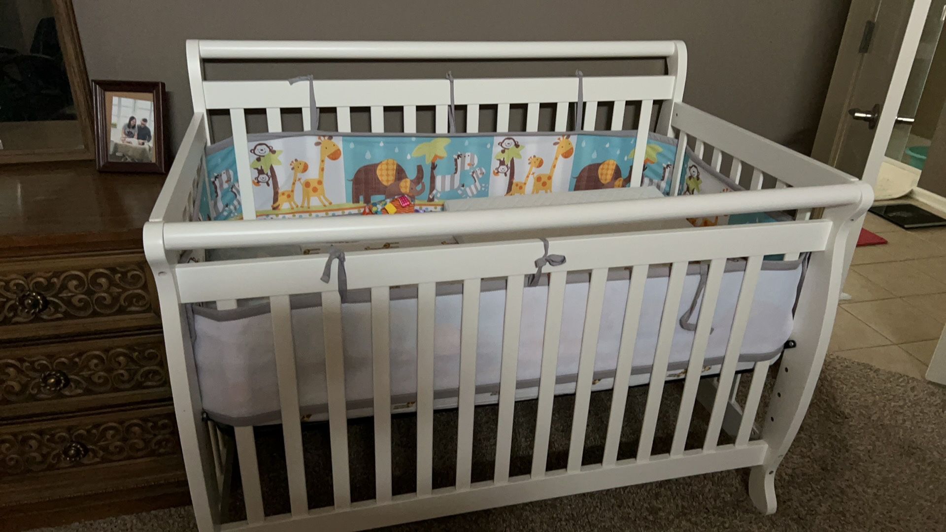 baby crib,solid wood,very good condition,include Sheet, Bumper, Pillow