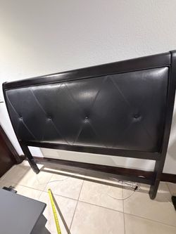 Black frame bed with mattress