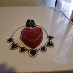 Red Heart Jewelry Box With A Necklace And Earrings