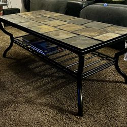 Black metal and slate coffe table from Ashley Furniture