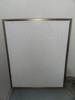Modern textured wall artwork with gold frame