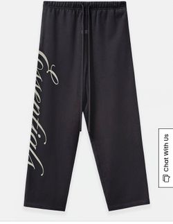 Fear of God Essentials shirt and baggy caligraphy sweatpants