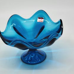 Vintage Mid-Century Viking 6 Petal Electric Blue Glass Compote Dish Hand 
made. Perfect shape, no chips or cracks. Display item.
It is 4.5" tall, diam