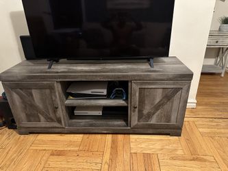 Raymond and Flanigan TV stand