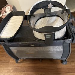 Graco Pack n Play Dome Playard with Baby Bassinet, Lightweight Portable Push-Button Fold Travel Crib